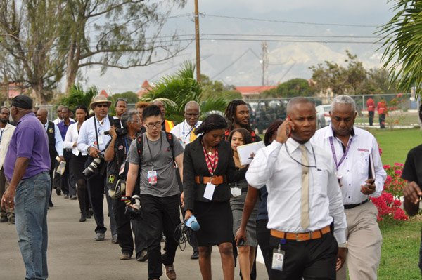 Jermaine Barnaby/Photographer
Jamaican media personnel entering heroes Park just before US President Barrack Obama laid a wreath at National Heroes Park on Thursday April 9, 2015.