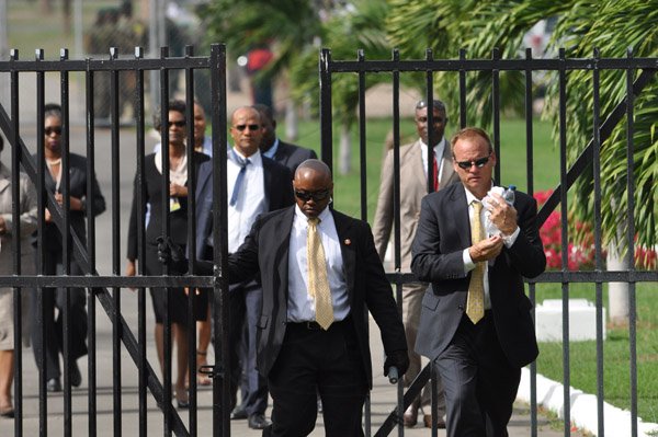 Jermaine Barnaby/Photographer
Security detail entering Heroes Park just before the US President Barrack Obama laid a wreath at National Heroes Park on Thursday April 9, 2015.