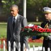 Jermaine Barnaby/Photographer
Major Steven Schreiber of US Marine Corps carries a wreath that US President Barrack Obama laid at National Heroes Park on Thursday April 9, 2015.