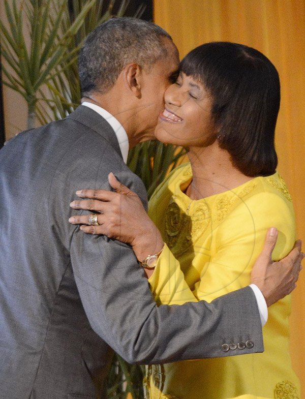 Rudolph Brown/Photographer
Jamaican Prime Minister Portia Simpson-Miller greets President Barack Obama with a kiss at Jamaica House, in Kingston, Jamaica on Thursday, April 9, 2015,