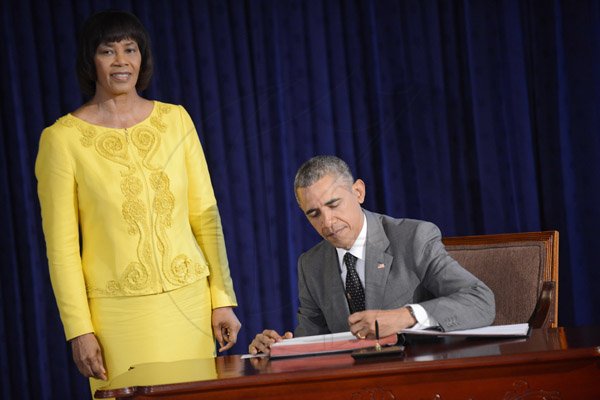 Rudolph Brown/Photographer
Jamaican Prime Minister Portia Simpson-Miller greets President Barack Obama at the Jamaica House, in Kingston, Jamaica on Thursday, April 9, 2015,