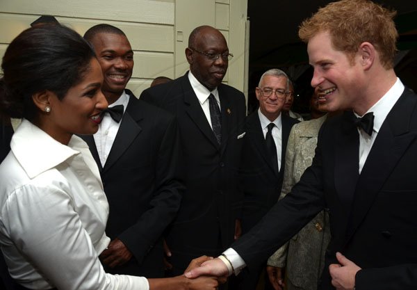 JIS
Prince Harry
His Royal Highness, Prince Henry of Wales (always known as Prince Harry), greets Minister of Youth ad Culture, Hon. Lisa Hanna (left), who was among Government Ministers presented to the Prince by Prime Minister, the Most Hon. Portia Simpson Miller (2nd right),  at last night State Dinner held in his honour at King’s House. Others from ( 2nd left are): State Minister for  Foreign Affairs and Foreign Trade, Hon. Arnoldo Brown; Health Minister, Hon. Dr. Fenton Ferguson; and Education Minister, Hon. Rev. Ronald Thwaites. The dinner was hosted by Governor-General, His Excellency the Most Hon. Sir Patrick Allen.