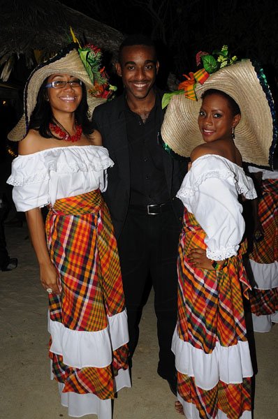 It was all about Prince Harry on Jamaica Night at Sandals Cay in Montego Bay but Evon Benjamin (centre) of Jamaica Tourist Board could not resist being beside these beauties Shelly-Ann Fung-Holloway (left) and Jody-Ann Robinson