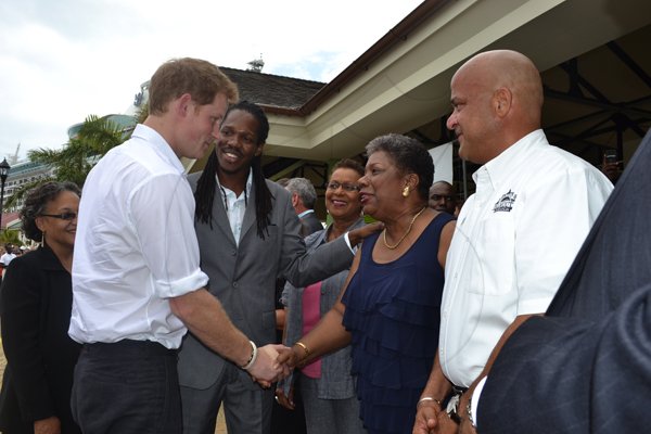 JIS
Prince Harry in Falmouth
His Royal Highness, Prince Henry of Wales (always known as Prince Harry) (at left), greets Director General in the Ministry of Tourism and Entertainment, Carole Guntley (second right), who is being introduced to him by Minister of State in the Ministry of Tourism and Entertainment, Hon. Damion Crawford (second left). Prince Harry had just arrived on the Falmouth Pier for the  second leg of his four-day visit to Jamaica.