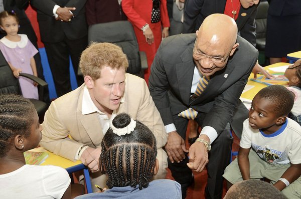 Rudolph Brown/Photographer
Prince Harry and Sir Patrick Allen chat with children during a visit the Bustamante Hospital for Children on Tuesday, March 6-2012