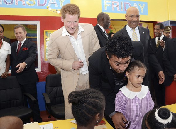 Rudolph Brown/Photographer
Shaggy chat with children while Prince Harry and Sir Patrick Allen, (right) Governor general of Jamaica looks on during a visit the Bustamante Hospital for Children on Tuesday, March 6-2012