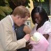 Rudolph Brown/Photographer
Prince Harry chat with Diane Tomlin and Baby Ayannal while Patricia Cespedes-myrie after unveil statue at Victoria Jubilee Hospital on Tuesday, March 6-2012