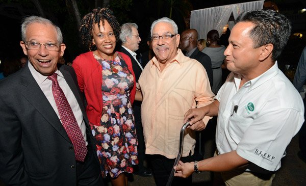 Rudolph Brown/Photographer
Opal Levy –Clarke, International Private Banker of  Scotia Private Client Group chat with from right Omar Azan, CEO of BOSS, James Moss Solomon and Robert Levy, Chairman of Best Dressed at the Scotia Private Client Group cocktail at the Terra Nova Hotel in Kingston on Thursday, January 22, 2016