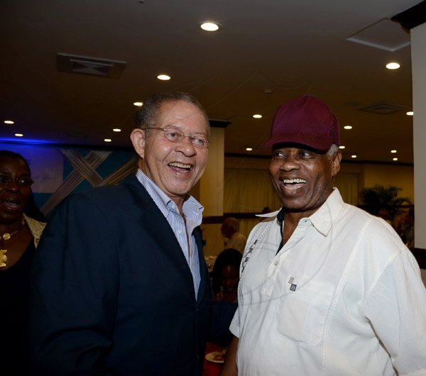 Winston Sill/Freelance Photographer
PRO Com 35th Anniversary Clients and Media Reception, held at the Jamaica Pegasus Hotel, New Kingston on Wednesday night December 4, 2013. Here are Bruce Golding (left), former Prime Minister; and cartoonist Livingston McLaren (right).