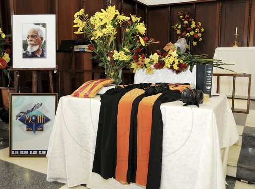 Gladstone Taylor / Photographer

The cremated remains of Professor Aggrey Brown stop atop the symbols of the life and loves on the alter inside the chapel at the service of thanksgiving  held at the University Chapel, Kingston