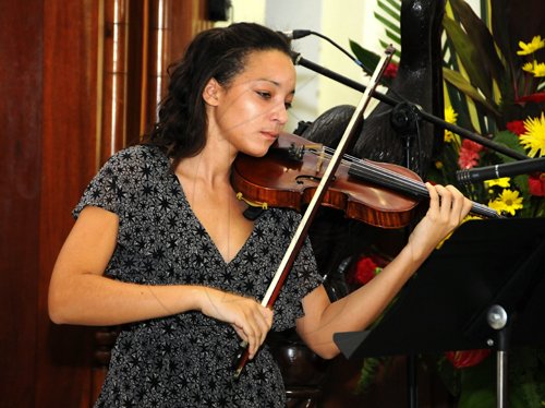Gladstone Taylor / Photographer

Kari Brown (daughter) performs a musical selection " theme from schindler's list" as seen at the service of thanksgiving for the life of W. Aggrey Brown held at the UWI Chapel, Kingston