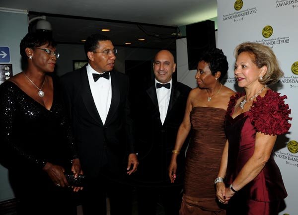 Winston Sill / Freelance Photographer
The Private Sector Organization of Jamaica (PSOJ) 20th  annual Hall of Fame Banquet, held at the Wyndham Kingston Hotel, New Kingston on Wednesday night November 14, 2012. Here are Juliet Holness (left); Andrew Holness (second left); Christopher Zacca (centre); Sandra Glasgow (second right); and Lorna Myers (right).
