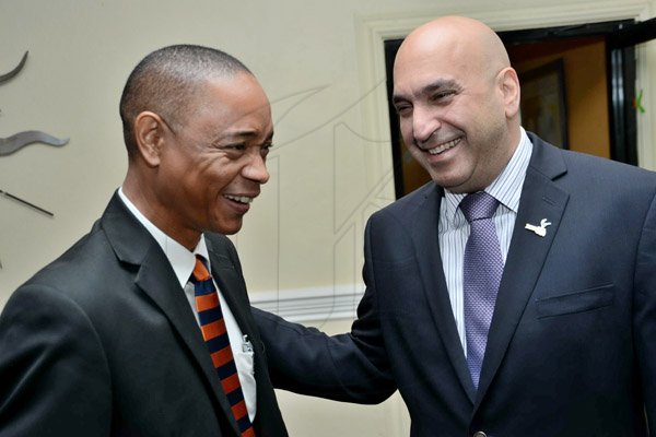Rudolph Brown/Photographer
Business Desk
Christopher Zacca, (right) President of PSOJ greets Dennis Chung at the PSOJ Chairman Club Forum breakfast meeting at Knutsford Court Hotel in Kingston on Tuesday, May 28, 2013
