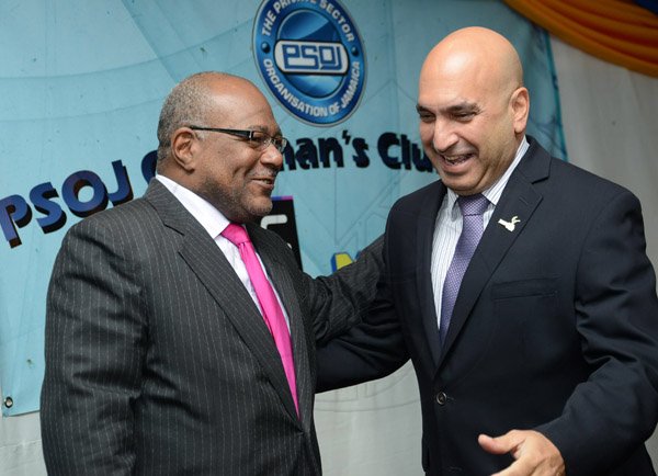 Rudolph Brown/Photographer
Business Desk
Christopher Zacca, (right) President of PSOJ greets Dennis Chung at the PSOJ Chairman Club Forum breakfast meeting at Knutsford Court Hotel in Kingston on Tuesday, May 28, 2013