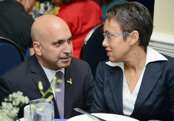 Rudolph Brown/Photographer
Business Desk
Christopher Zacca, President of PSOJ chat with Jacqueline Sharp, Executive Vice President and CFO, Scotia at the PSOJ Chairman Club Forum breakfast meeting at Knutsford Court Hotel in Kingston on Tuesday, May 28, 2013