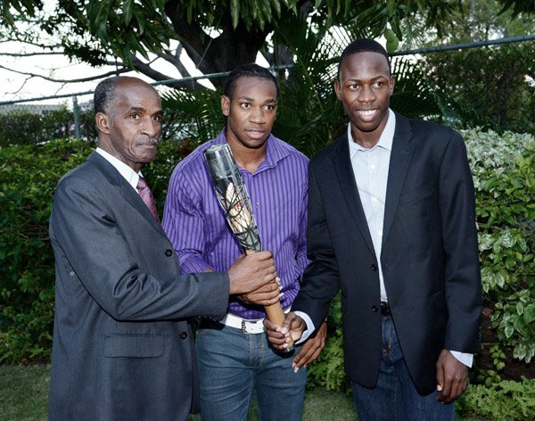 The past, the present and the future of track share in a special moment with the queen's baton. From left: the great Donald Quarrie, the beast Yohan Blake and rising star Jevon Francis
Winston Sill/Freelance Photographer
British High Commissioner David Fitton host Welcome Reception for the arrival of the Queen's Baton, held at Trafalgar House, Trafalgar Road on Saturday evening April 5, 2014.
