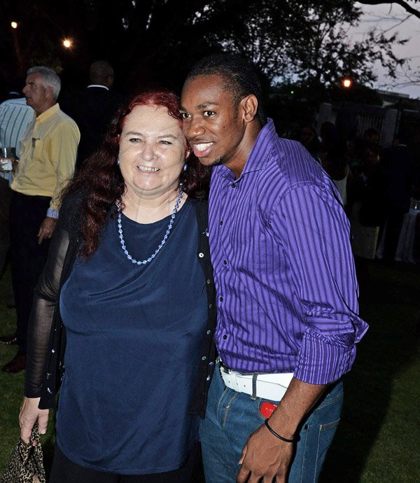 Blogger Emma Lewis shares the spotlight with track star Yohan Blake 
Winston Sill/Freelance Photographer
British High Commissioner David Fitton host Welcome Reception for the arrival of the Queen's Baton, held at Trafalgar House, Trafalgar Road on Saturday evening April 5, 2014.
