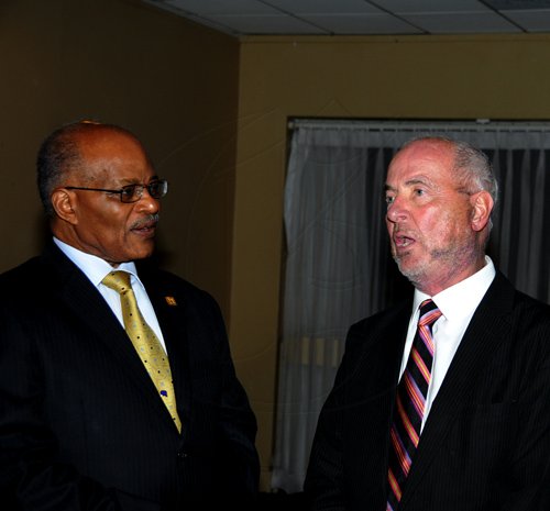 Winston Sill / Freelance Photographer
President of the World Federation of Consuls (WFC), Arnold Foote Jr. host Reception for Prof. Michael Nobel, of the Nobel Prize family, held at the Jamaica Pegasus Hotel, New Kingston on Thursday night January 12, 2012. Here are Sir Kenneth Hall (left); and Prof. Nobel (right).