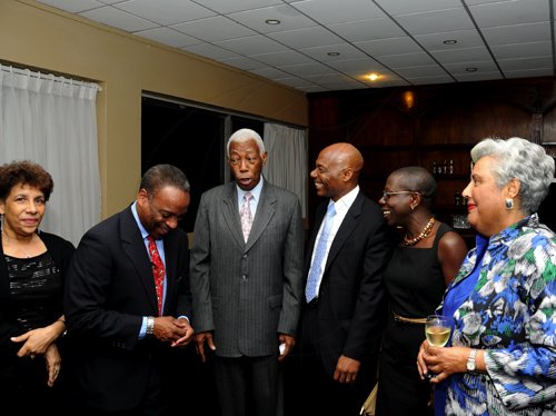 Winston Sill / Freelance Photographer
President of the World Federation of Consuls (WFC), Arnold Foote Jr. host Reception for Prof. Michael Nobel, of the Nobel Prize family, held at the Jamaica Pegasus Hotel, New Kingston on Thursday night January 12, 2012. Here from left are Elizabeth Samuda; Milton Samuda; Foreign Affairs Minister A.J. Nicholson; Gene Leon; his wife Brenda Leon; and Marjory Kennedy.