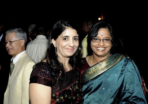 Winston Sill / Freelance Photographer
Shalini Lachmandas (left) and Jayashree Kumaraswamy smile for the camera.

The High Commissioner of India Mohinder Grover and wife Vardeep Grover host reception on the occasion of the 63rd Republic Day of India, held at India House, East Kings House Road on Thursday January 26, 2012.