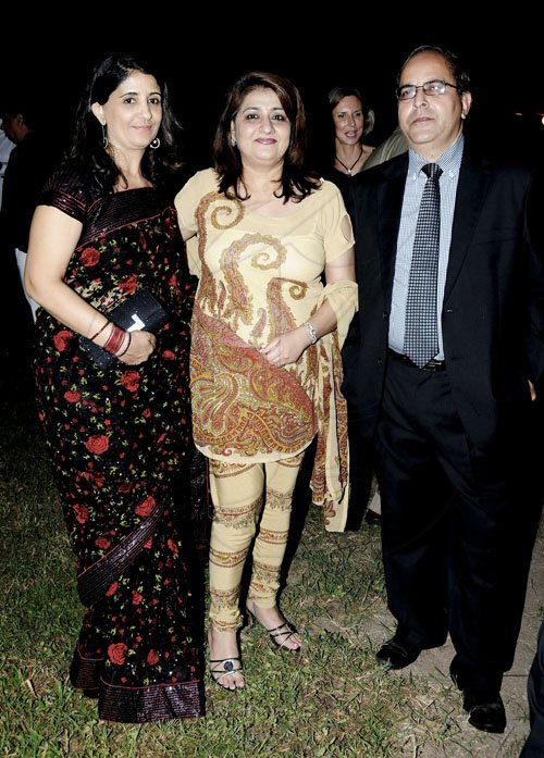 Winston Sill / Freelance Photographer
Shalini (left) and Anisa Lachmandas keep the company of Anil Saxena from the Indian High Commission.



er of India Mohinder Grover and wife Vardeep Grover host reception on the occasion of the 63rd Republic Day of India, held at India House, East Kings House Road on Thursday January 26, 2012.