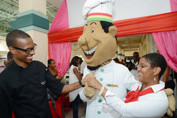 Rudolph Brown/Photographer
Chef Brian Lumley and Joan Forrest-Henry greets mascot chef at the Reggae Jammin special viewing of the movie Disney Planes hosting they valued Customers Children at Palace Cineplex, Sovereign on Saturday, August 17, 2013