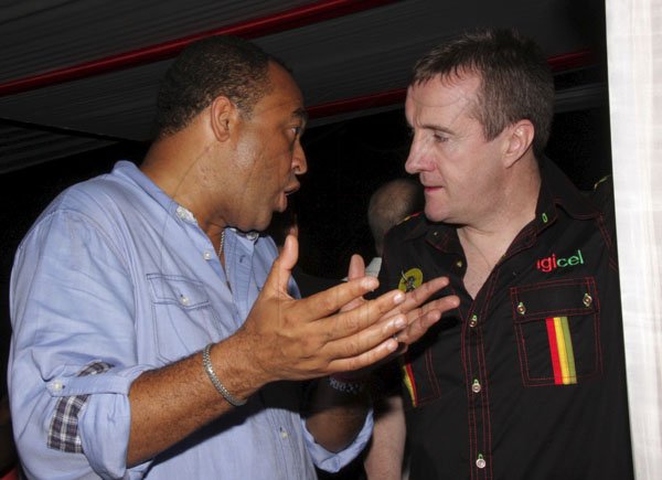 Contributed
Sumfest -  Business Talk Perhaps!- Minister of Industry and Commerce, Dr Christopher Tufton engages CEO of Digicel, Mark Linehan in the Digicel VIP lounge  at Reggae Sumfest.