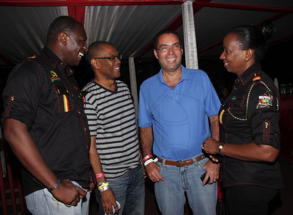 Contributed
Reggae Sumfest - A culture yard discussion perhaps. Here Minister of Information, Honourable Daryl Vaz (second right) catches up with Mayor of Montego Bay, Charles Sinclair (second left) and  the Digicel team of Dwayne Bennett (left) and Head of Business Sales – West, Joy Clarke (right).
