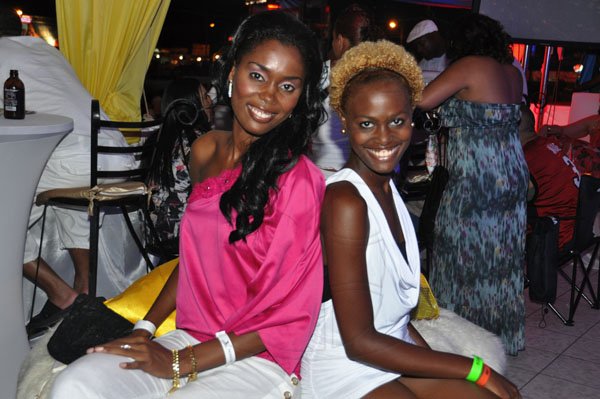 Janet Silvera Photo
 
Salome Campbell (left) and Sasha-Gail Haase added beauty to an already fabulous Iberostar booth at the Reggae Sumfest 2011 last Friday night at Catherine Hall in Montego Bay.