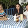 Carl Gilchrist/Freelance Photographer
Judy-Ann MacMillan (left) and Gunvor Magarity-Groves share table space with Mykonos' Greek Bar and Grill owner, Dimitri Konidis during Restaurant Week 2011. Konidis told us the week has been "fantastic" at Mykonos, situated along  Main Street in Ocho Rios.


, according to owner Dimitri Konidis.