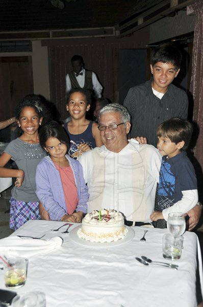 Sheena Gayle/Gleaner Writer

 The Gleaner?s Director Winston Dear celebrated his 71st birthday during Restaurant Week at Marguerite's Seafood by the Sea on Monday and was given a surprise by relatives with this birthday cake. He is surrounded by his grandchildren from left: Kenya Dear, Ella Hamilton, Skylar Hamilton, Krystian and Kai Dear.