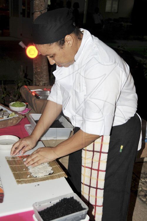 Mark Titus 
Shandre Chen Tai, kitchen manager at Seahorse Grill restaurant prepares delicious sushi at the Montego Bay launch of the Gleaner sponsored Restaurant Week at   the Montego Bay Yacth Club on Monday.