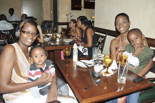 Sheena Gayle/Gleaner Writer
Restaurant Week
From left,  Kareen Spence White with her 8 month old son Jon Michael White and sister Simone Spence and 8 year-old Jayden White at Angela’s Italian Restaurant in Montego Bay. The family could not miss out on the great meals during Restaurant Week in the second city.