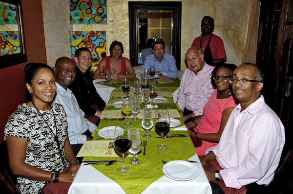 Winston Sill / Freelance Photographer
Clockwise from left: Suzann Bowen, Michael Hylton, Bruce Bowen, Monica Ladd, Fraser Thornton, Oliver  F. Clarke, Gleaner chairman, Sheena Gibson and Dennis Harris, pose for the camera prior to dining at Cafe Eurasia to Tapas & Wine  kick off the eagerly anticipated  Gleaner sponsored pre Restaurant Week dinners on Monday night. Standing behind them is restaurant owner  Andy Dhanpaul.

**********************************************************************Chairman Oliver Clarke host guests to dinner, held at Cafe Eurasia Tapas and Wines, Market Place on Monday night November 7, 2011.