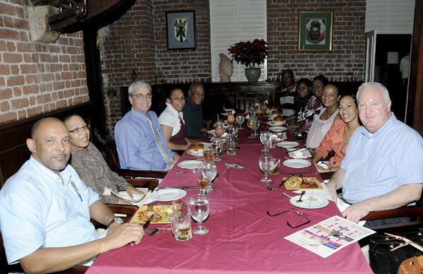 Winston Sill / Freelance Photographer
Restaurant Week: CB Chicken and guests dine, at the Grog Shoppe, Devon House, Hope Road on Wednesday night November 16, 2011. Here from left are  Colin Henry; Joanna Mangal; Mark Haskins, CEO, Caribbean Broilers; Janet Welch; Everett Welch; Paul Sterling; Oneika Sterling; Suzanne Dixon; Stacey Newman; Kimberley Mullings, Brands Manager, CB Chicken; and Robert Mason, Director, Sales and Marketing, CB Chicken.