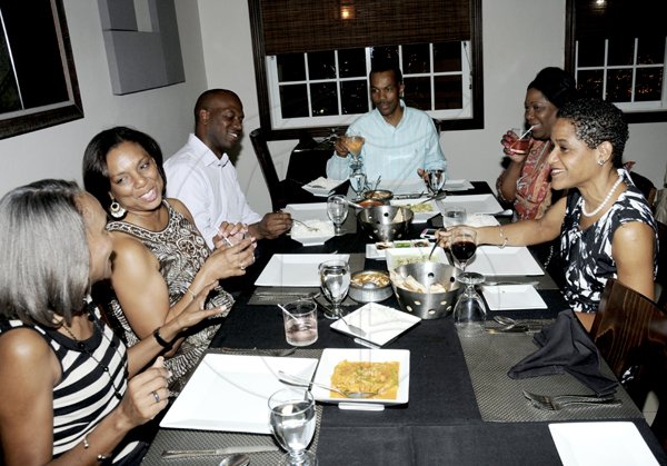 Winston Sill / Freelance Photographer
The Gleaner's  Colin Bourne (table head) spiced up the palettes of his guests at Tamarind  Indian Cuisine restaurant in Orchid Village plaza on Tuesday. From left are: Janet Delisse, Lois Bourne, Ramon Pitter, Sonia Davidson; and Janelle Brown.