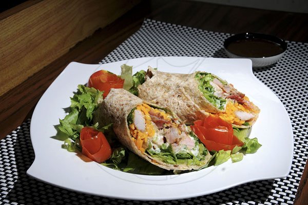 Gladstone Taylor / Photographer

Jerk Pork Wrap from Muffin Top, is stuffed with a variety of vegetables, mozarella and cheddar cheese. 

Muffing Top

Restaurant week