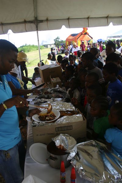 Christopher Serju/Gleaner Writer
Birthday celebration - The children were very orderly as they waiting in line to be served treats.