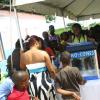 Christopher Serju/Gleaner Writer
Birthday celebration - Children and adults alike watch in fascination as the operator crushes ice to make sno cones.