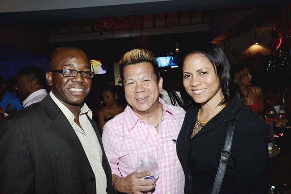 Winston Sill/Freelance Photographer
Brian "Ribbie" Chung Birthday Party, held at Ribbiz Ultra Lounge, Acropolis Gaming Loung, Loshusan Shopping Centre, Barbican on Thursday night April 24, 2014. Here are Pernell Charles Jr. (left); Ribbie Chung (centre); and Maraika Beckford (right).