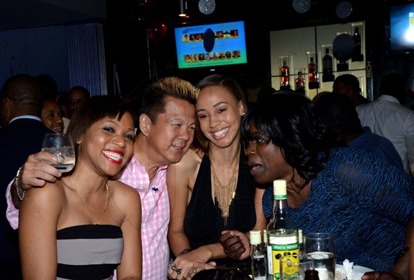 Winston Sill/Freelance Photographer
Brian "Ribbie" Chung Birthday Party, held at Ribbiz Ultra Lounge, Acropolis Gaming Loung, Loshusan Shopping Centre, Barbican on Thursday night April 24, 2014. Here are Roshani Howard (left); Ribbie Chung (second left); Gianna Johnson (second right); and entertainer Elva (right).