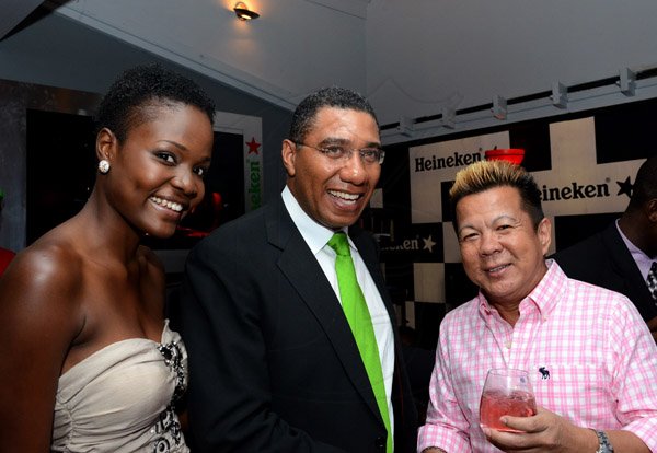 Winston Sill/Freelance Photographer
Brian "Ribbie" Chung Birthday Party, held at Ribbiz Ultra Lounge, Acropolis Gaming Loung, Loshusan Shopping Centre, Barbican on Thursday night April 24, 2014. Here are ---??? (left); Andrew Holness (centre); and Ribbie Chung (right).