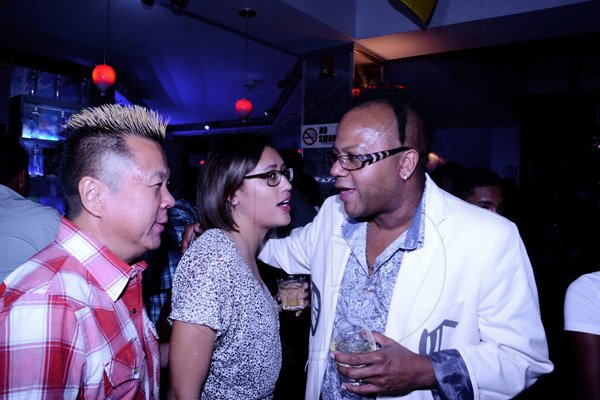 Winston Sill/Freelance Photographer
Ribbiz Ultra Lounge 1st Anniversary Party, held at Acropolis Gaming Lounge, Loshusan Shopping Centre, East Kings House Road on Thursday night July 10, 2014. Here are Brian Chung (left); Red Stripe's Erin Mitchell (centre); and Don Creary (right).