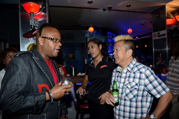 Winston Sill/Freelance Photographer
Ribbiz Ultra Lounge host the Grand Unveiling of World Cup Viewing Party, held at Batbican Centre, East King's House Road on Wednesday night June 11, 2014. Here are Don Creary (left); Erin Mitchell (centre), Brand Manager, Red Stripe; and Brian Chung (right).