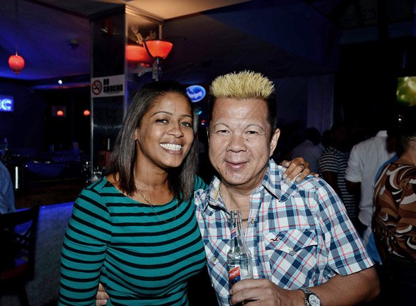 Winston Sill/Freelance Photographer
Ribbiz Ultra Lounge host the Grand Unveiling of World Cup Viewing Party, held at Batbican Centre, East King's House Road on Wednesday night June 11, 2014. Here are Terry-Ann? Thelwell (left); and Brian Chung (right).