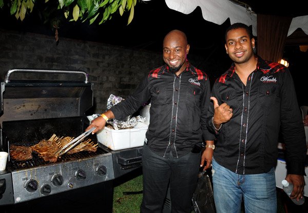 Winston Sill/Freelance Photographer
Knotts Landing presents Rib, Roast and Rum, all you can eat party, held at Hopefield Avenue on Friday night August 30, 2013. Here are Garth Walker (left); and Kamal Bankay? (right).