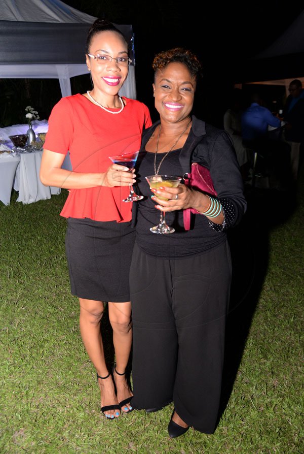 Jermaine Barnaby/ Freelance PhotographerKeneshai Delatebudair (left) of CGR communications and Roxanne Walters of the RJR communications group at the  RJRGLEANER CLIENT APPRECIATION AWARDS at the Sunken Gardens at Hope Botanical Gardens on Thursday, June 22, 2017.