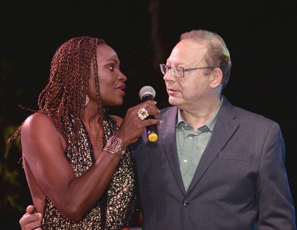 Jermaine Barnaby/ Freelance PhotographerMc Jenny Jenny (left) congratulating Peter Lampert whose company, Advertising and Marketing Jamaica Limited walked away with four awards at the RJRGLEANER CLIENT APPRECIATION AWARDS at the Sunken Gardens at Hope Botanical Gardens on Thursday, June 22, 2017. *** Local Caption *** Jermaine Barnaby/ Freelance PhotographerMaster of Ceremonies Jenny Jenny (left) congratulates Peter Lampert, whose company, Advertising and Marketing Jamaica Limited walked away with four awards at the RJRGleaner Client Appreciation Awards.