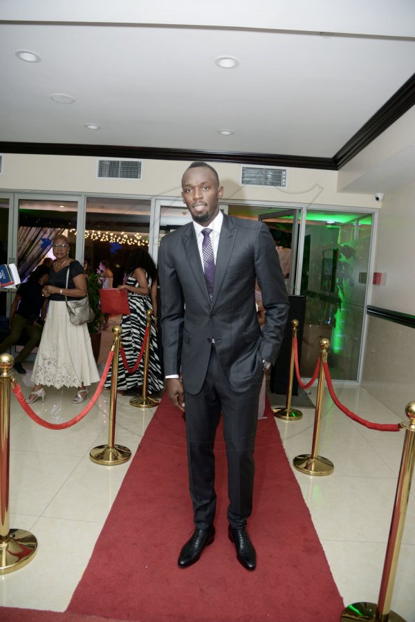 Gladstone Taylor<\n>Jamaica's darling Usain Bolt, works the red carpet as well as he does the track as he arrives for the RJR Sports man and Woman awards at the Jamaica Pegasus hotel last Friday.