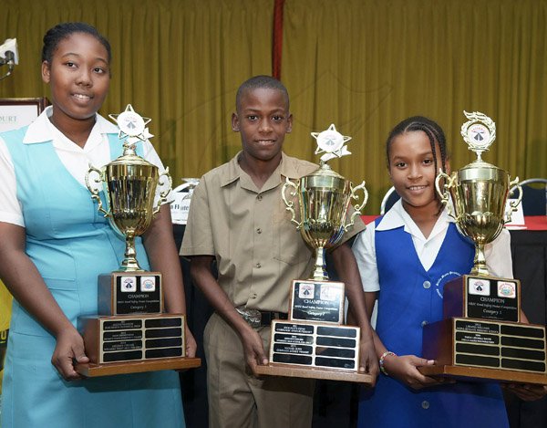 Ian Allen/Staff Photographer
Winners of the National Road Safety Council Road Safety Poster  2014 Competition from left are Mishawn Chin-See from Ardenne High School, Michael Gunn from Corinaldi Primary School and Taeija-Lee Hall from Stella Maris Preparatory School.